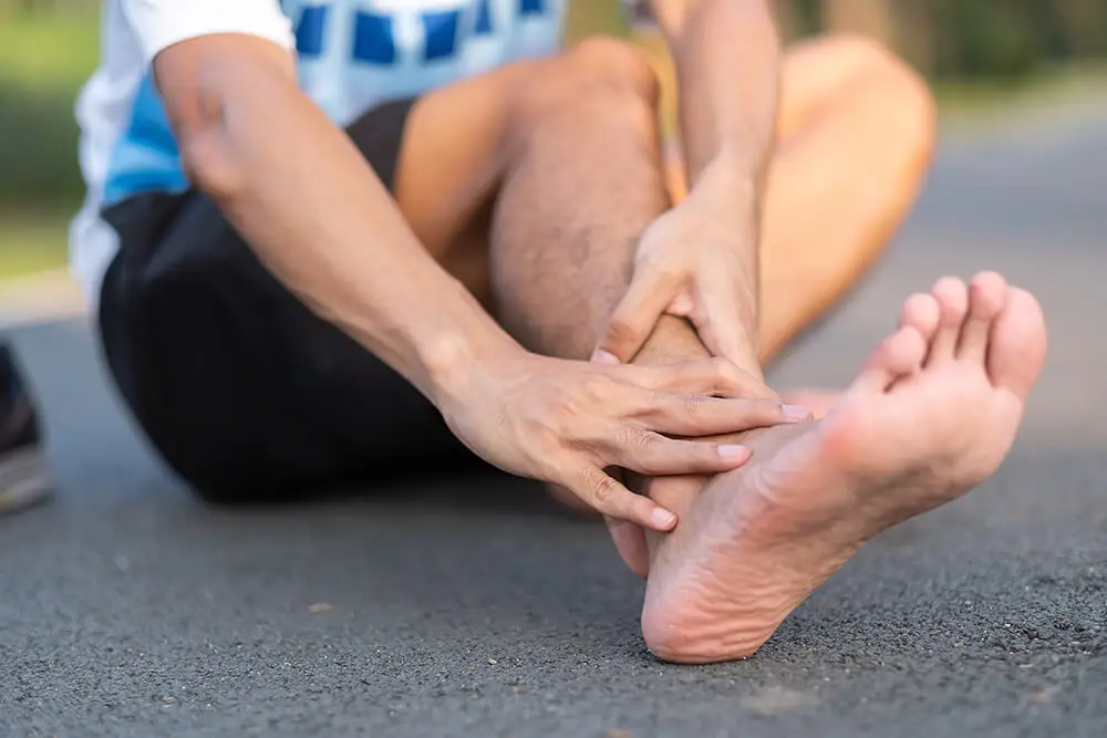3 PT treatments for a sprained ankle that's also causing knee pain young fitness man holding his sports leg injury 2023 11 27 05 11 29 utc 3 pt treatments for a sprained ankle that's also causing knee pain knee pain