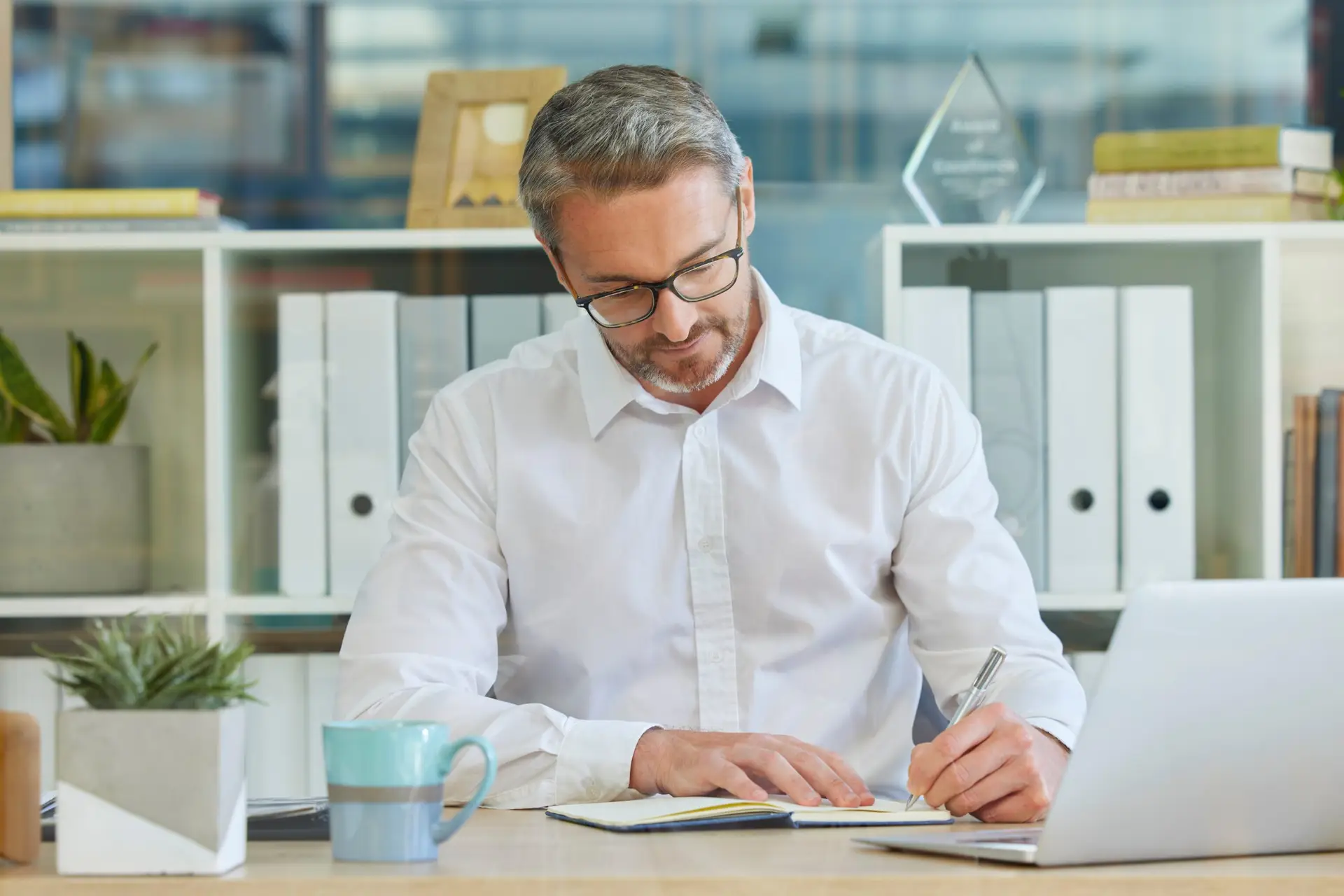 The PT clinic's Medicare compliance checklist businessman writing in notebook and working in ac 2023 01 06 17 01 27 utc scaled The PT clinic’s Medicare compliance checklist